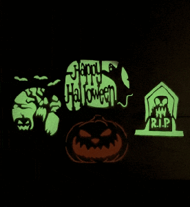 Halloween scene with flashing UV light making the designs glow in the dark