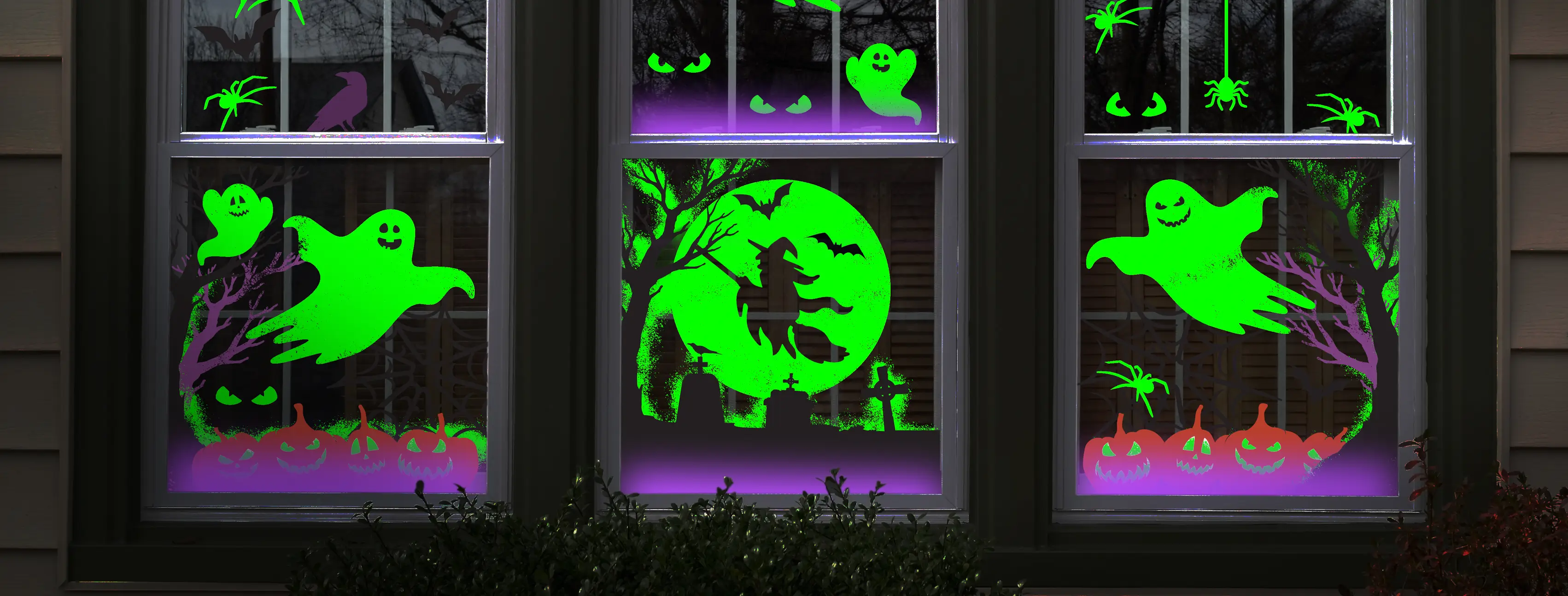 A Holiday Spray scene on 3 windows made with the Halloween kit and glow-in-the-dark chalk spray